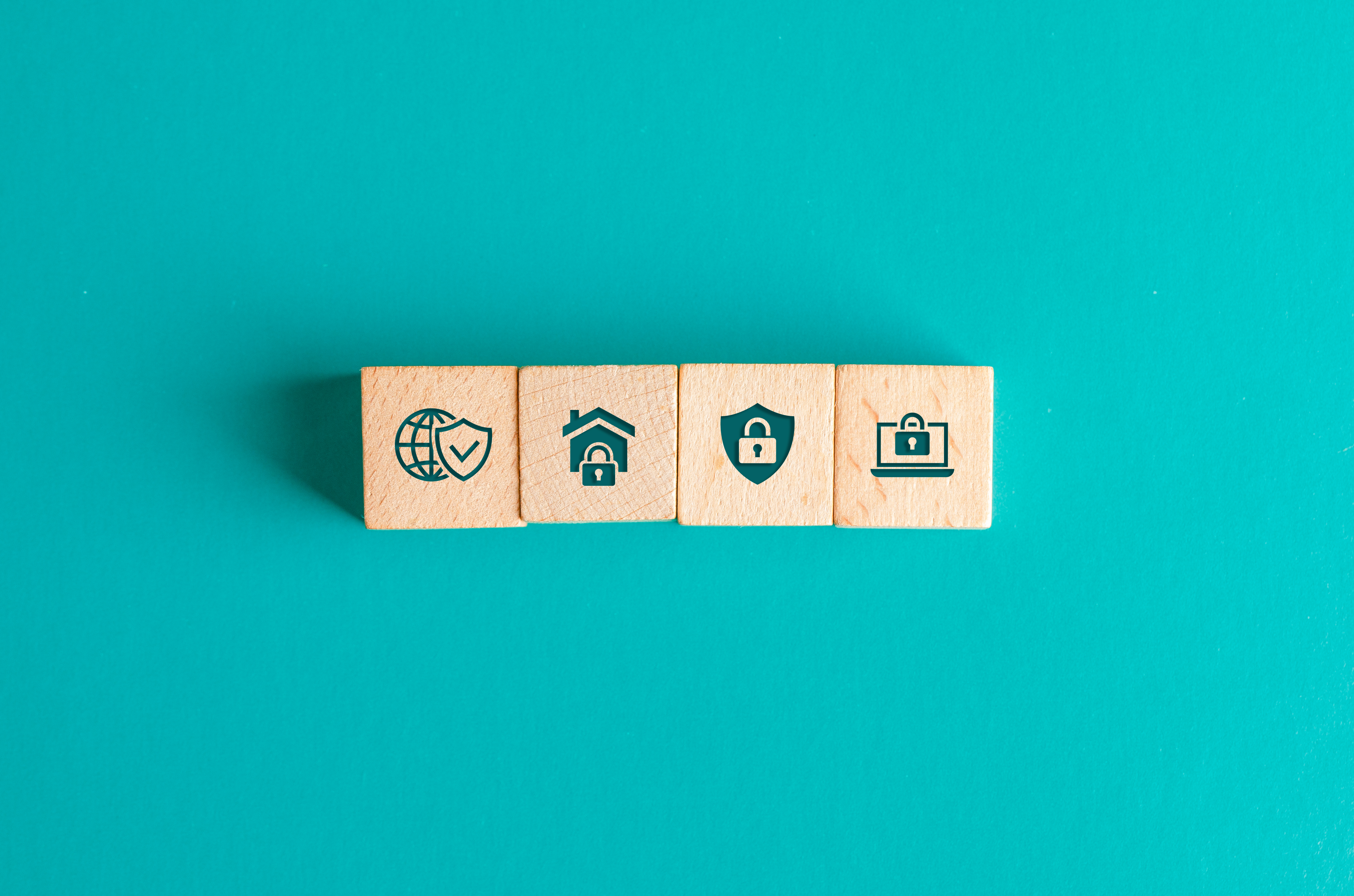 security-concept-with-icons-wooden-blocks-turquoise-table-flat-lay security-concept-with-icons-wooden-blocks-turquoise-table-flat-lay